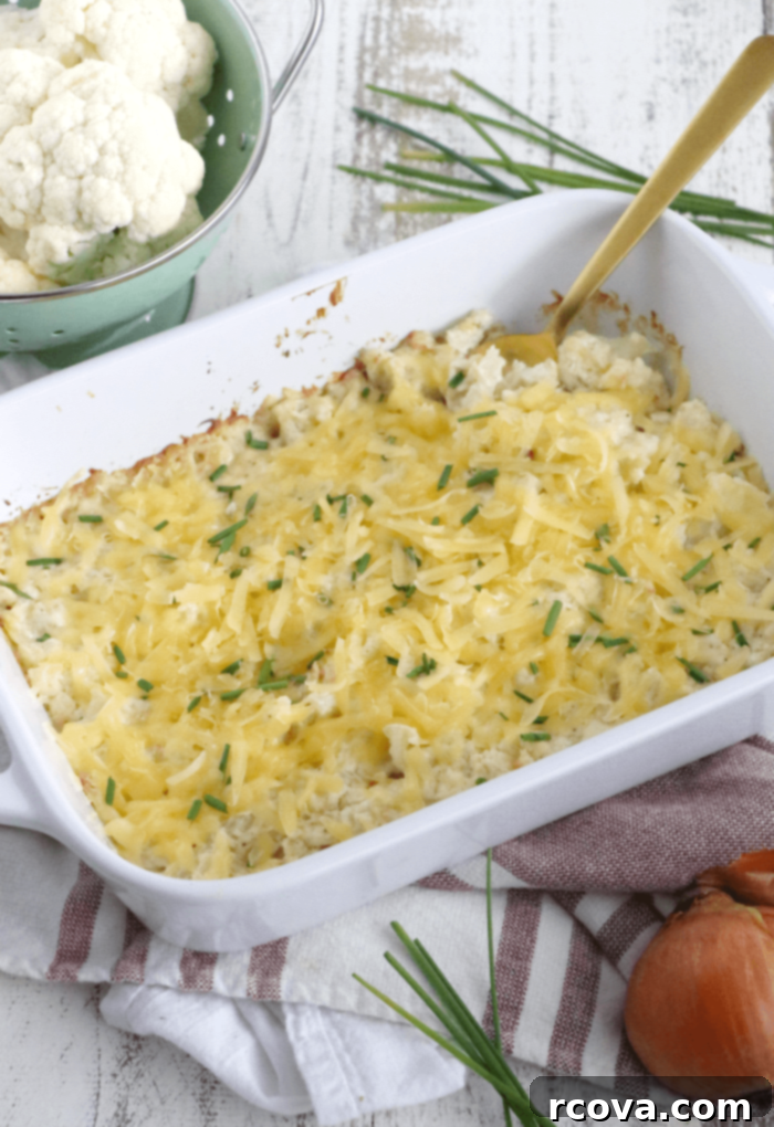 Golden Smoked Gouda Cauliflower Bake 3 Close-up of creamy Smoked Gouda Cauliflower Casserole with melted cheese and fresh chives garnish
