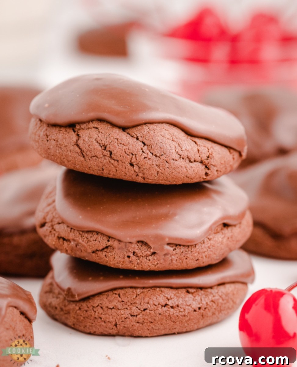 Decadent Double Chocolate Cherry Cookies 3 A stack of freshly baked double chocolate cherry cookies, showing off their fudgy texture and cherry centers