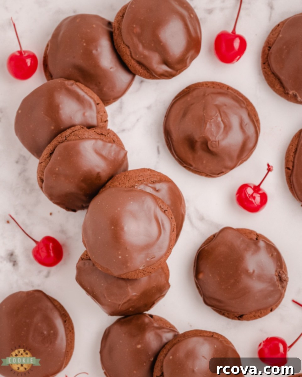 Decadent Double Chocolate Cherry Cookies 6 Close up of a double chocolate cherry cookie with a thick fudge topping, ready to be enjoyed
