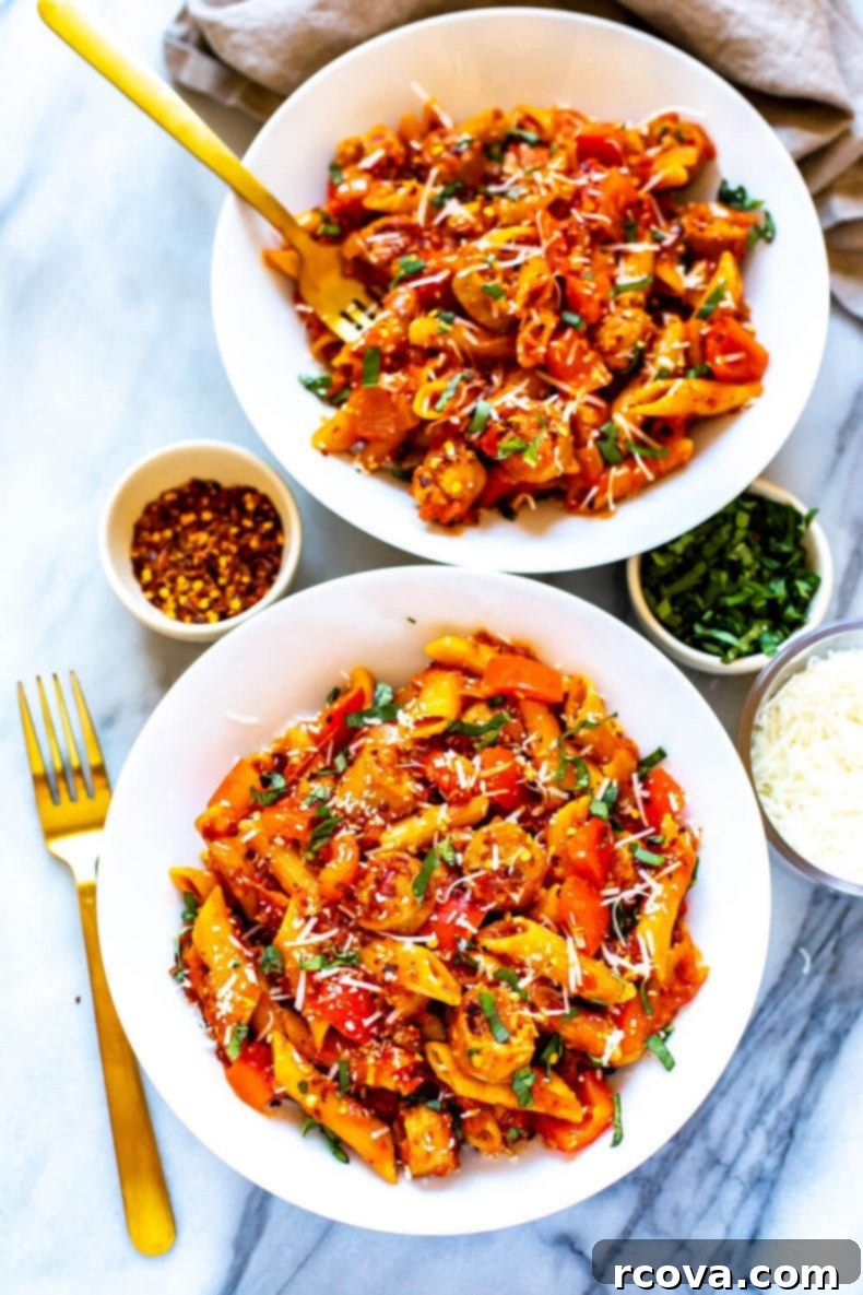 Serving suggestion: Two inviting bowls of spicy Arrabiata pasta with a savory sauce and tender penne, showcasing a healthy and quick one-pot dinner idea. Two generously filled bowls of spicy Arrabiata sauce pasta, garnished and ready for serving, perfect for a satisfying meal.