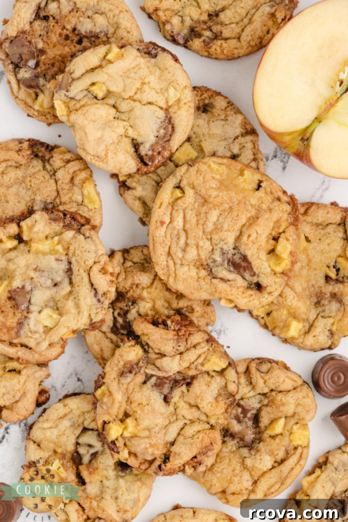 Irresistible Caramel Apple Cake Mix Cookies 3 A plate of golden-brown cake mix cookies with visible apple chunks and melted Rolo candies, ready to be served.