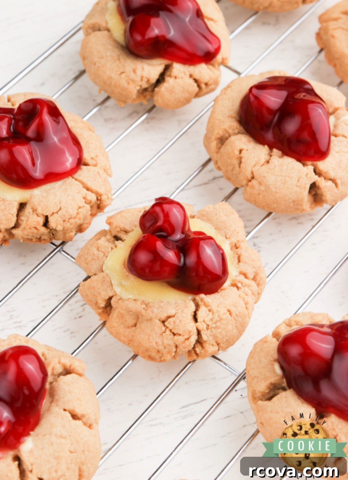 Cheesecake Stuffed Cookies 2 Cheesecake Cookies are graham cracker cookies baked with a simple cheesecake filling and topped with your favorite fruit or pie filling.