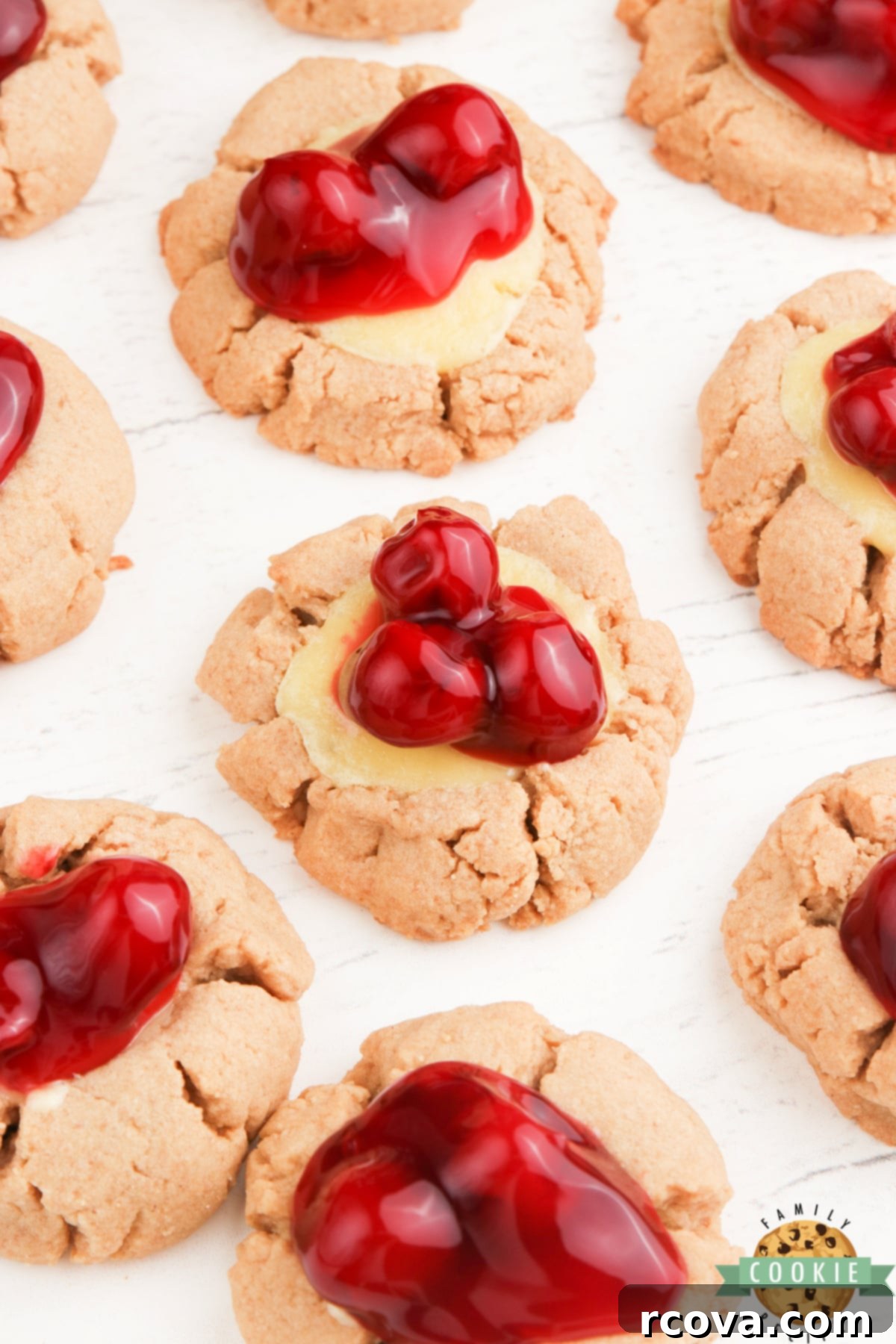 Cheesecake Stuffed Cookies 3 Graham cracker cookies with a cheesecake filling and cherries on top