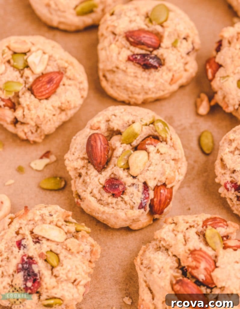 Trail Mix Peanut Butter Cookies: The Adventurous Bite 2 A plate of golden brown trail mix peanut butter cookies with a glass of milk.