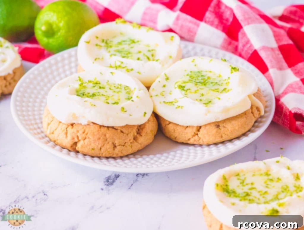 Key Lime Pie Cookie Delights 3 three key lime pie cookies on a plate, showing the detailed frosting and filling