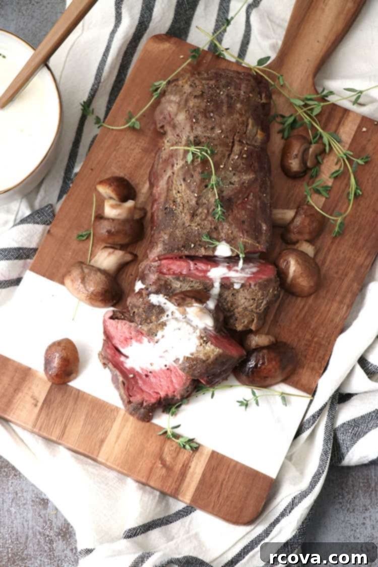 Roasted Beef Tenderloin with Velvety White Wine Cream 3 Close-up of a roasted beef tenderloin with mushrooms