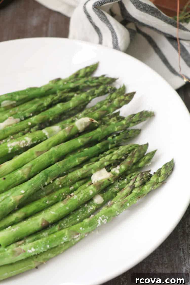 Crispy Parmesan Asparagus Spears 4 Sheet pan with roasted asparagus, ready to serve