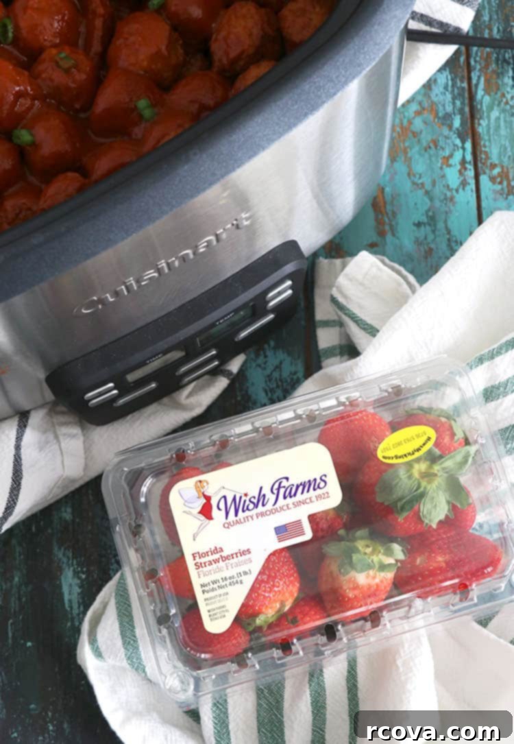 Sweet and Smoky Strawberry Chipotle Meatballs 7 Close-up of a Strawberry Chipotle BBQ Glazed Meatball on a fork