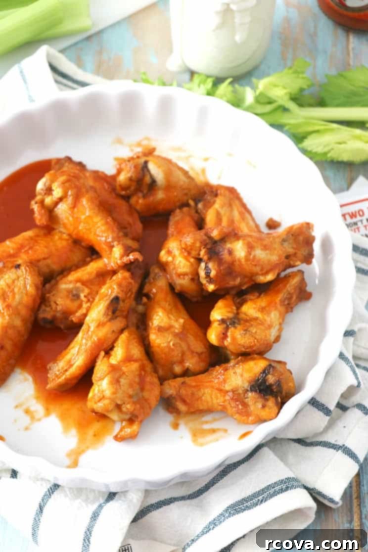 Guilt-Free Crispy Buffalo Wings 10 A basket of freshly air-fried buffalo wings, golden and inviting.