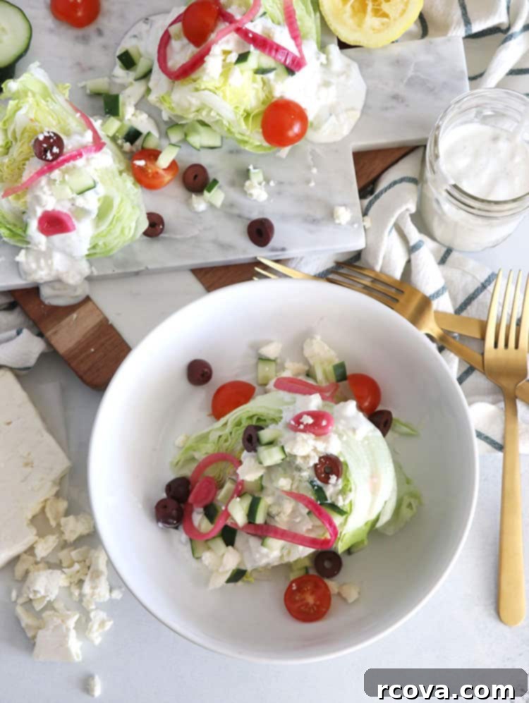 Vibrant Greek Wedge with Tangy Tzatziki Vinaigrette 4 Overhead view of a prepared Greek Wedge Salad ready to be served.