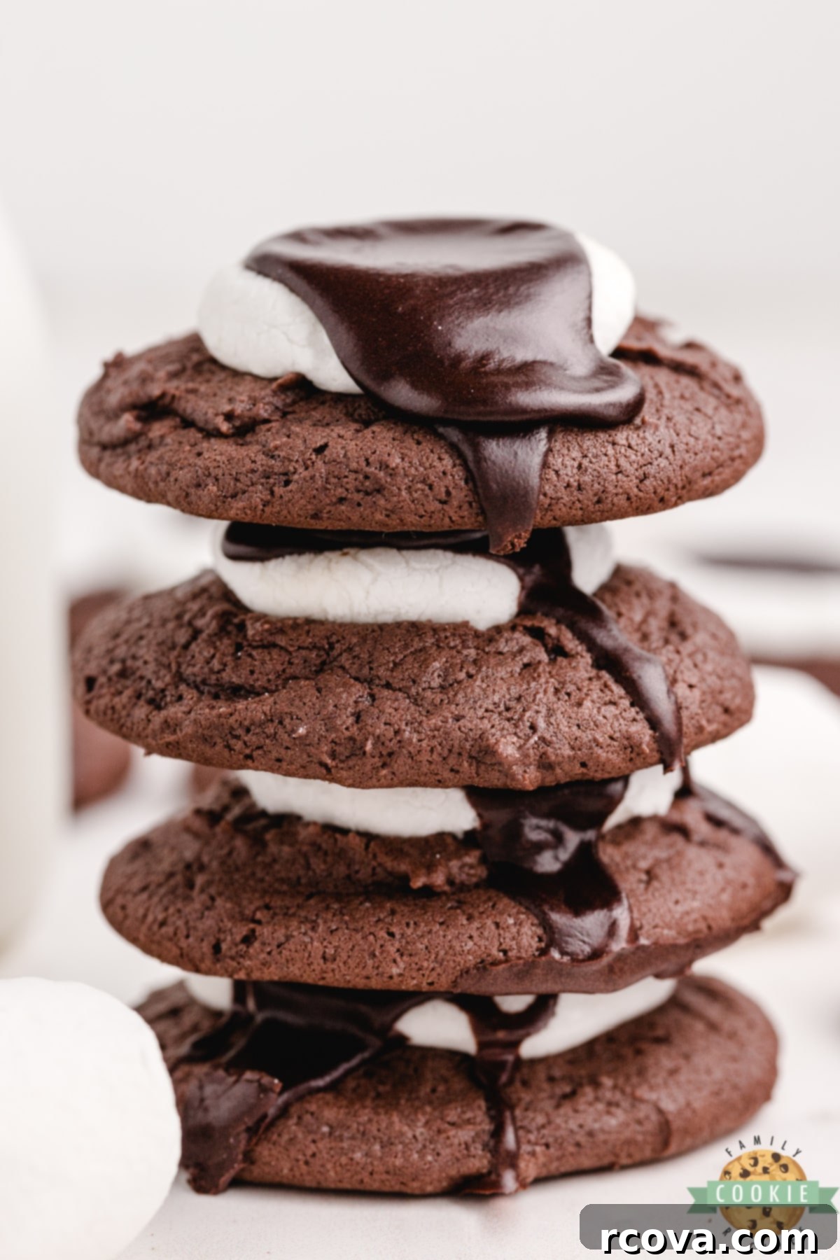 Gooey Chocolate Marshmallow Cookies 3 A stack of soft and chewy chocolate cookies with marshmallow and chocolate frosting