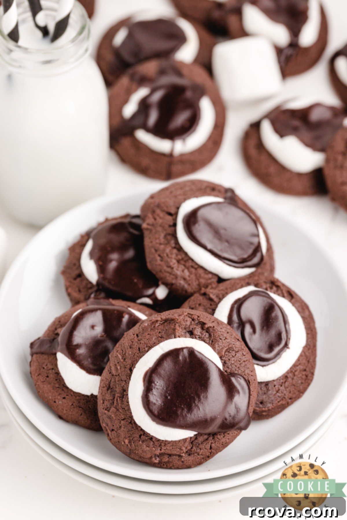 Gooey Chocolate Marshmallow Cookies 9 Overhead shot of several Chocolate Marshmallow Cookies on a white surface
