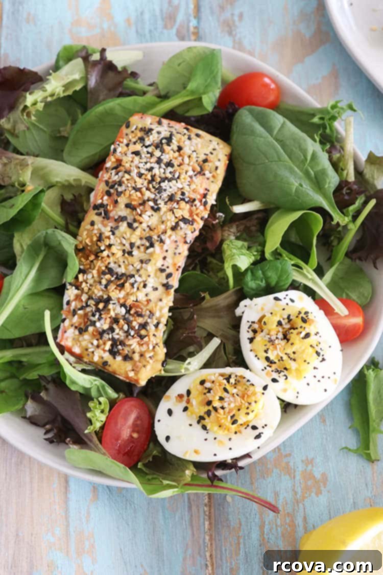 3 Ingredient Oven Baked Everything Bagel Salmon 3 Close-up of baked Everything Bagel crusted salmon fillet, showing the golden crust and flaky texture.