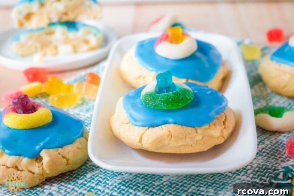 Poolside Cookie Bliss 9 Two gummy bear cookies with blue icing on a plate