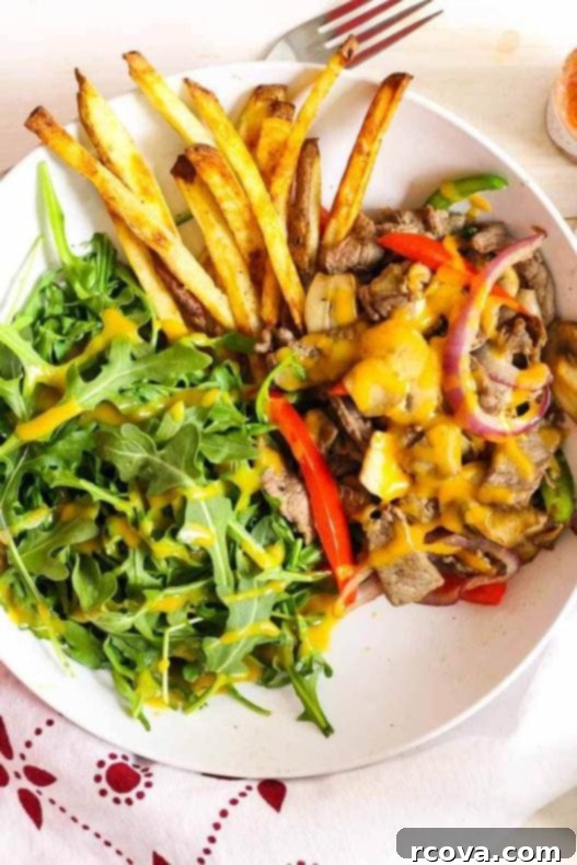 Low Carb Philly Cheesesteak Salad Bowls 7 Philly Cheesesteak Salad Bowl from an angled view, showing the layers of ingredients clearly.