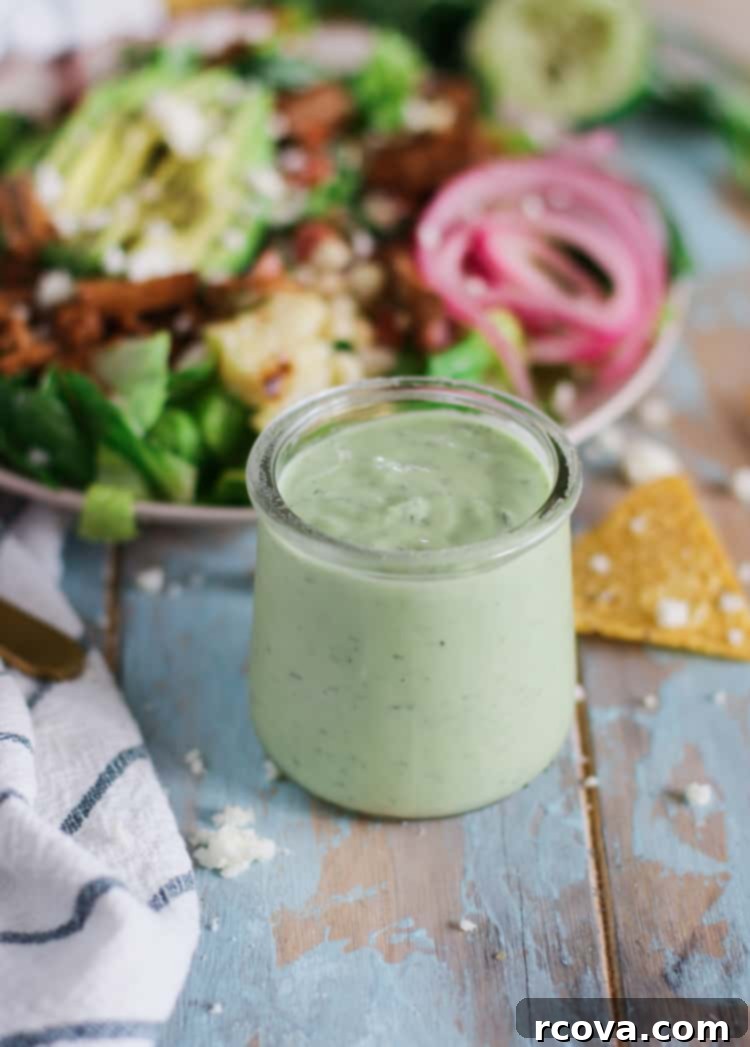 Homemade Low Carb Avocado Ranch Dressing 2 Fresh homemade avocado ranch dressing in a glass jar, perfect for salads and dipping.