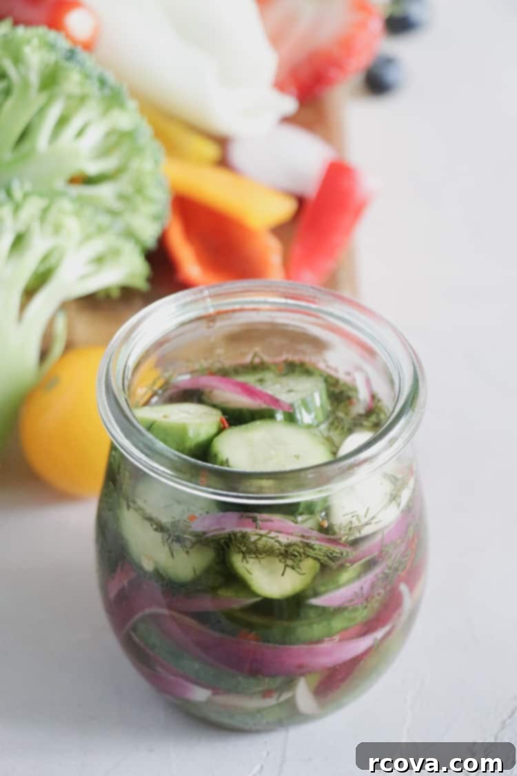Effortless Homemade Pickles 2 Freshly made easy homemade dill pickles in a mason jar, ready to be refrigerated.