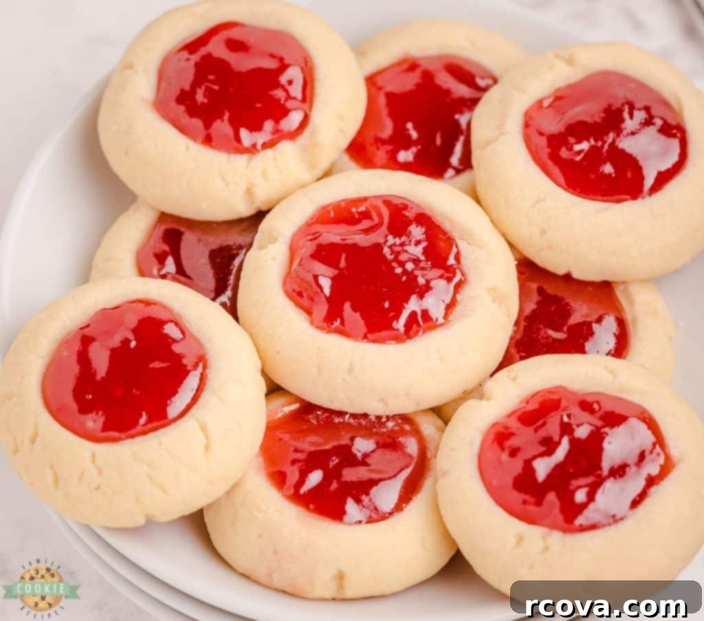 Strawberry Thumbprint Cookies: A Sweet and Simple Classic 6 Tray of freshly baked strawberry jam cookies, ready to be filled