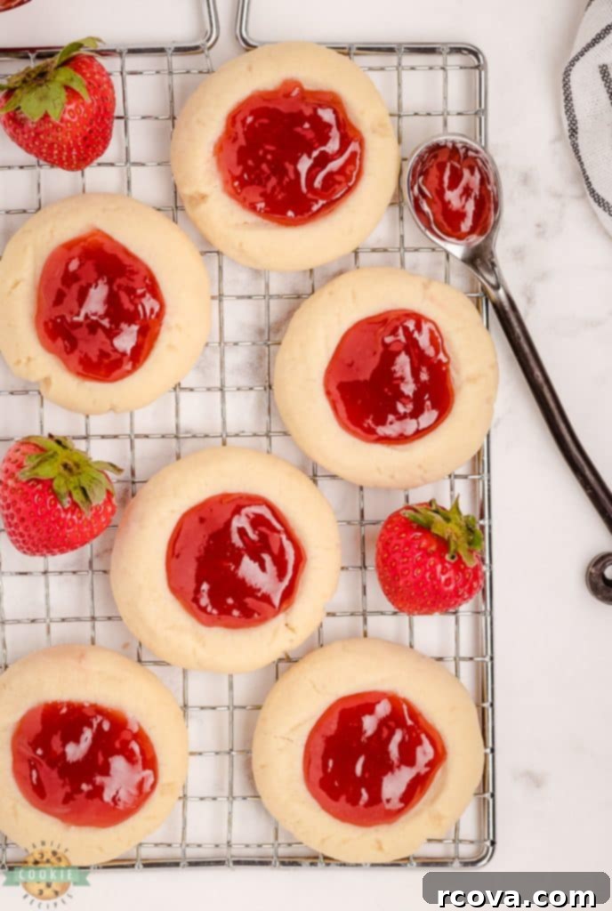Strawberry Thumbprint Cookies: A Sweet and Simple Classic 10 Cooling rack with several strawberry thumbprint cookies on it