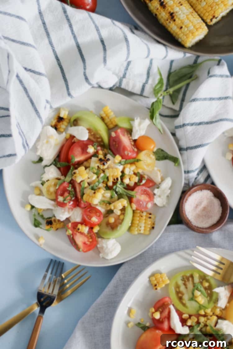 Fire Kissed Corn and Tomato Caprese 2 Charred Corn Caprese Salad. Grilled corn adds a depth of smoky sweet flavor to the classic Caprese Salad for summer!