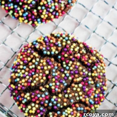 Confetti Chocolate Cookies 9 chocolate sprinkle cookies on a cooling rack