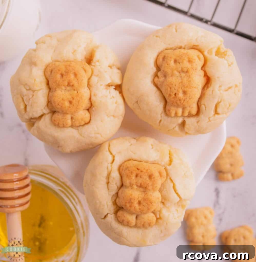 Golden Honey Butter Bears 9 A collection of cute Honey Butter Bear Cookies on a striped surface, ready to be enjoyed.