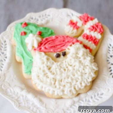 Classic Christmas Sugar Cookie Recipe 6 Classic Christmas sugar cookies decorated with festive buttercream frosting and sprinkles, a perfect holiday treat.