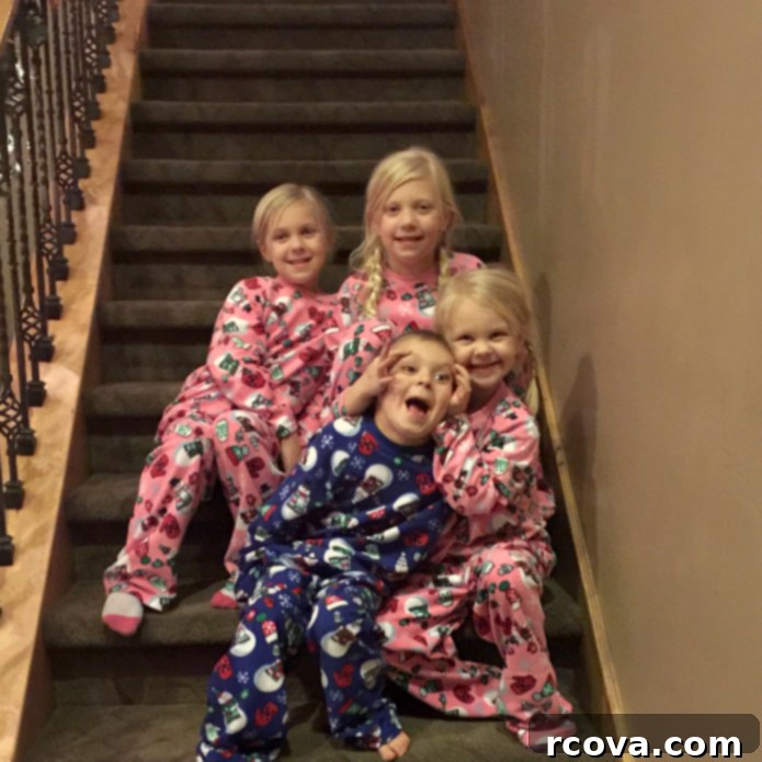 Classic Christmas Sugar Cookie Recipe 10 Family Christmas morning photo with children on the stairs before opening presents.
