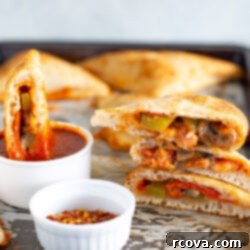 Whip Up Delicious Homemade Pizza Pockets 9 Homemade pizza pockets with a side of red chili flakes and extra marinara