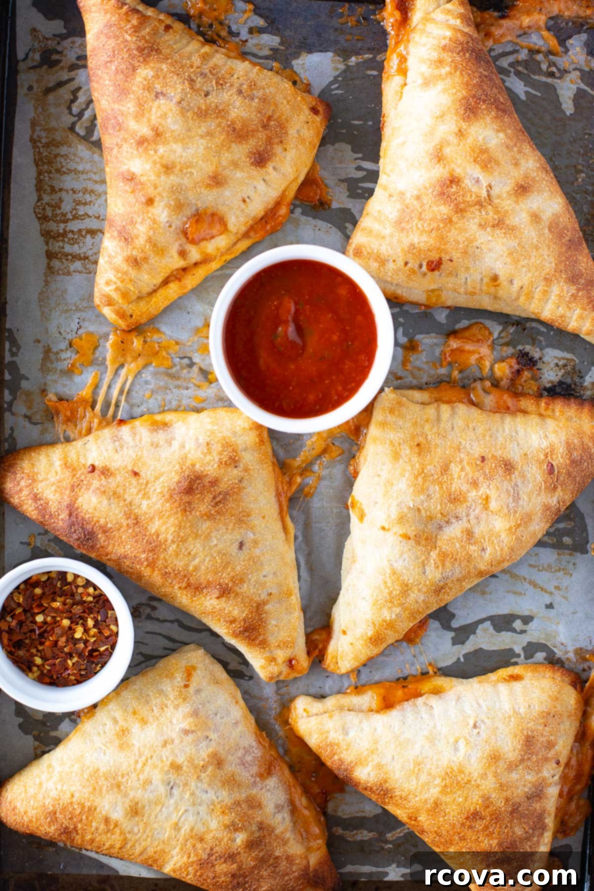 Whip Up Delicious Homemade Pizza Pockets 7 Close-up of freshly baked homemade pizza pockets on parchment paper