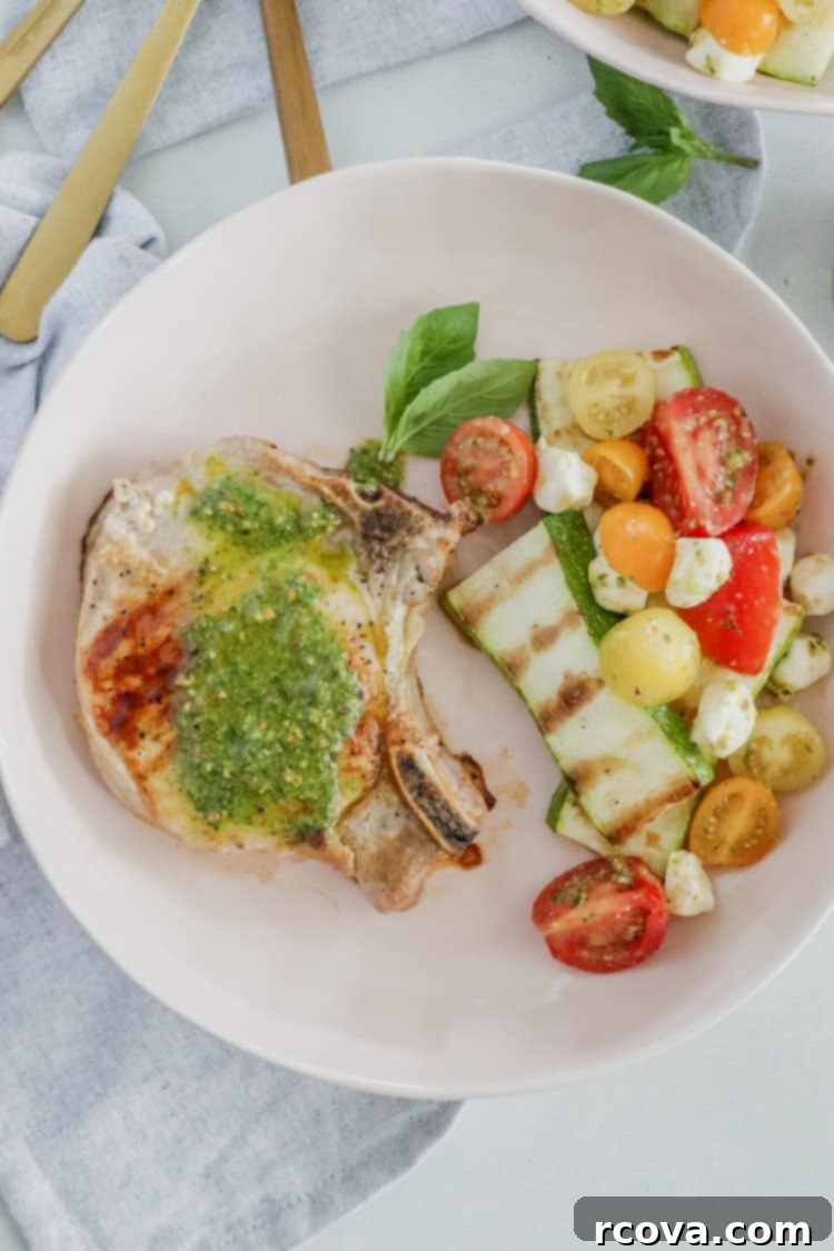 Delicious Pesto Grilled Pork Chops Low Carb Paleo Whole30 2 Pesto Grilled Pork Chops! Juicy grilled pork chops topped with a fresh and flavorful pesto sauce are ready to enjoy in under 30 minutes; this dinner tastes like the perfect summer meal!