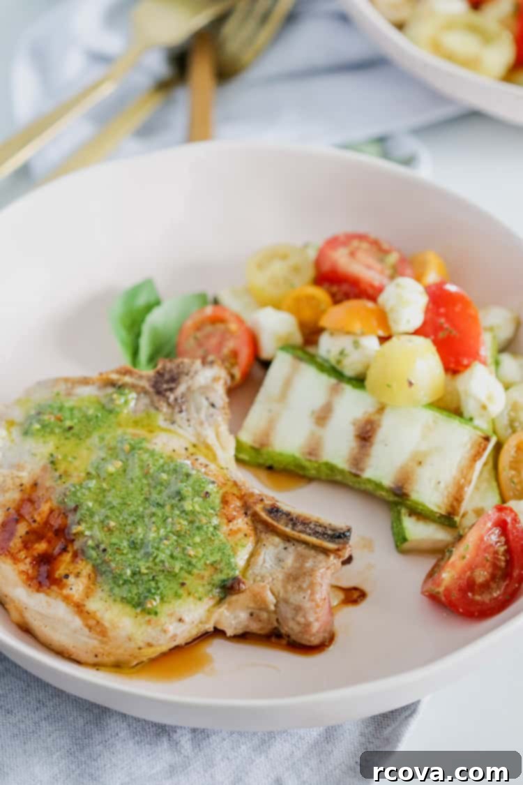 Delicious Pesto Grilled Pork Chops Low Carb Paleo Whole30 5 Pesto Grilled Pork Chops on a platter, ready to be served, a perfect and easy summer meal.