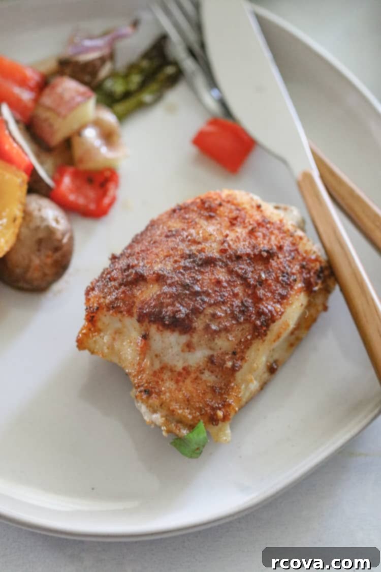 Smoky Paprika Sheet Pan Chicken 4 Garnished roasted paprika chicken and vegetables, ready to serve from the sheet pan