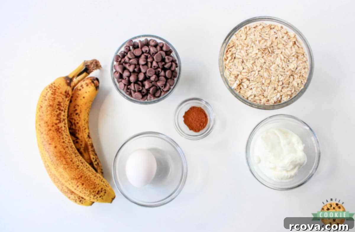 Sunrise Banana Oat Cookies 3 A bowl showcasing the simple ingredients used in Oatmeal Banana Breakfast Cookies, including ripe bananas, oats, yogurt, egg, and cinnamon.