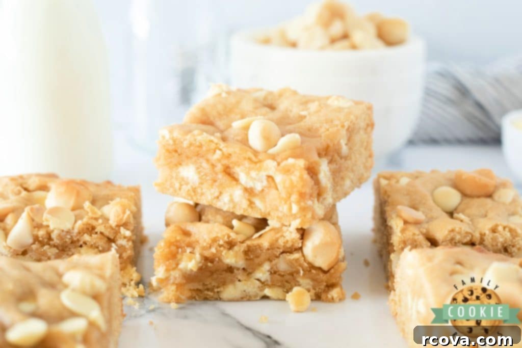 Irresistible White Chocolate Macadamia Blondies 3 Soft and chewy cookie bars featuring generous white chocolate chips and crunchy macadamia nuts.