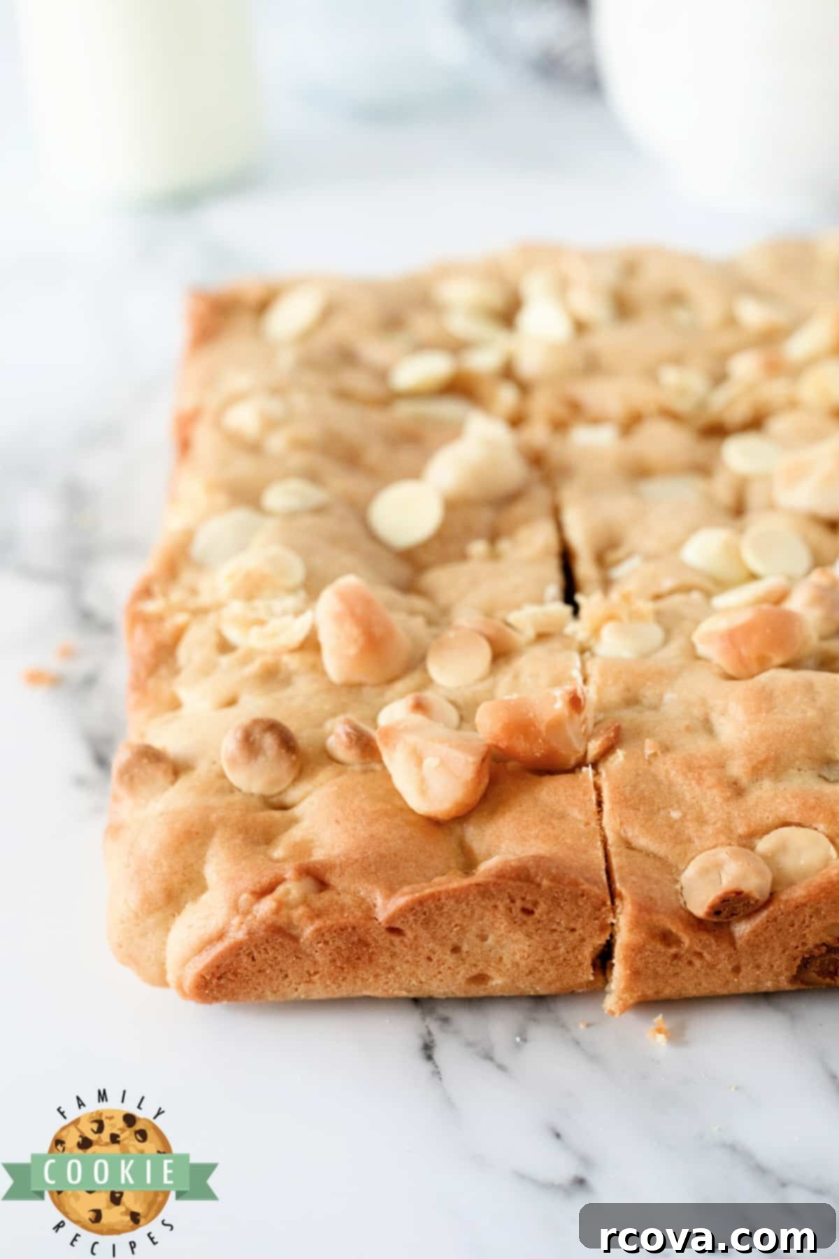 Irresistible White Chocolate Macadamia Blondies 6 Freshly baked White Chocolate Macadamia Cookie Bars, perfectly golden and ready to be enjoyed.