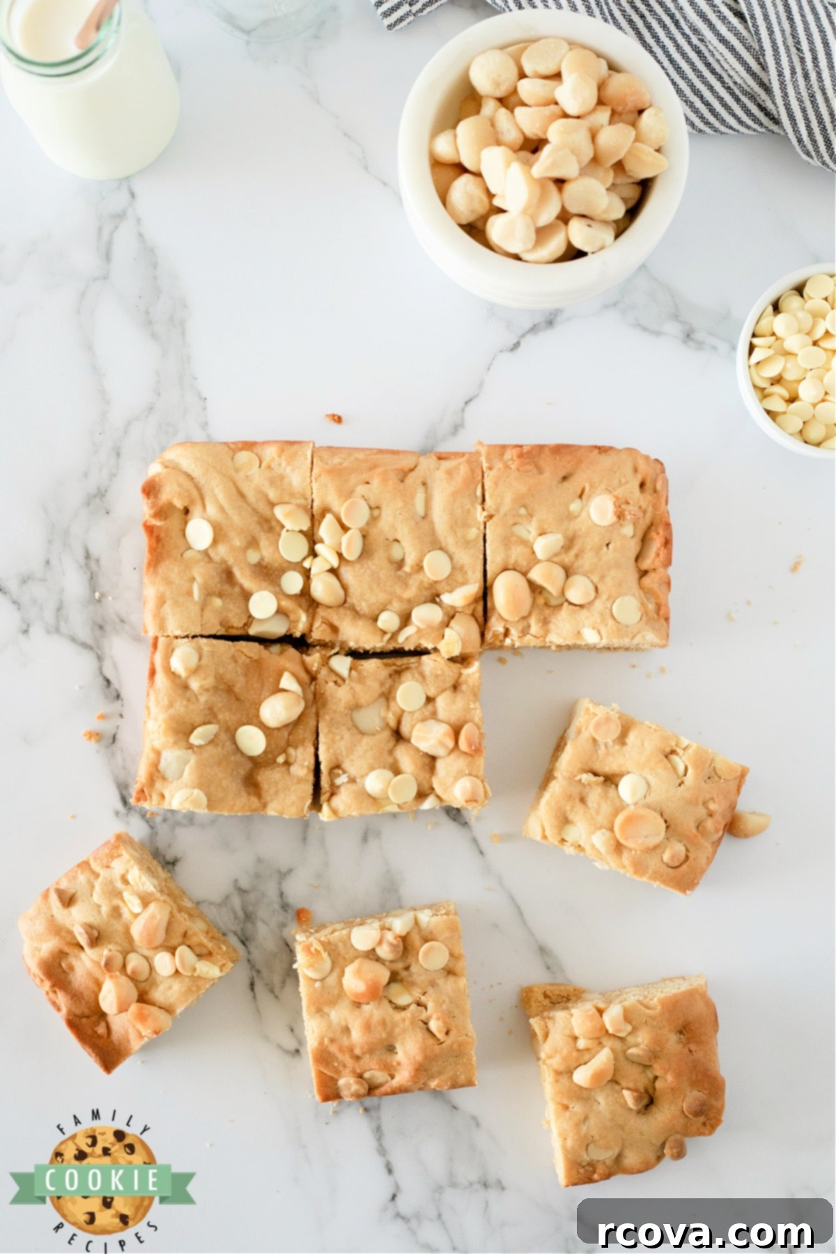 Irresistible White Chocolate Macadamia Blondies 8 Close-up of a perfectly baked White Chocolate Macadamia Cookie Bar, showcasing its thick, soft texture and generous fillings.