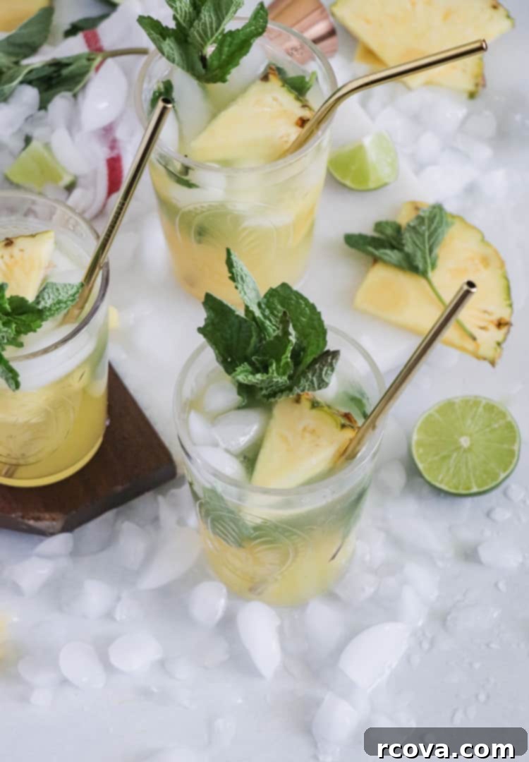 Pineapple Paradise Mojito 6 Close-up of Sparkling Pineapple Mojito with mint and pineapple garnish
