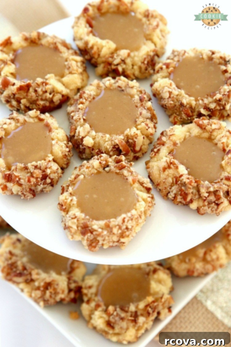 Gooey Caramel Thumbprint Delights 2 Caramel Thumbprint Cookies are a classic shortbread cookie rolled in pecans, baked & filled with warm caramel. Buttery Christmas cookies that everyone loves seeing at holiday cookie exchanges!