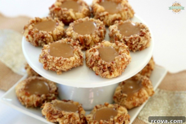Gooey Caramel Thumbprint Delights 7 Caramel Thumbprint Cookies are a classic shortbread cookie rolled in pecans, baked & filled with warm caramel. Buttery Christmas cookies that everyone loves seeing at holiday cookie exchanges!