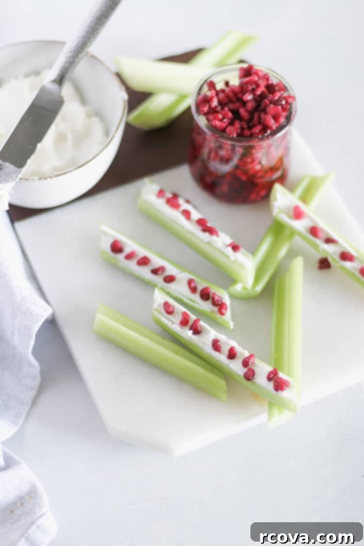 Jeweled Celery Bites with Goat Cheese and Pomegranate 4 Assortment of Goat Cheese and Pomegranate Stuffed Celery on a serving platter