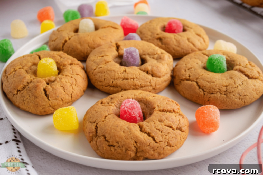 Holiday Cookie Magic: Recipes for Festive Cheer 19 Gumdrop Gingerbread Cookies on a cooling rack