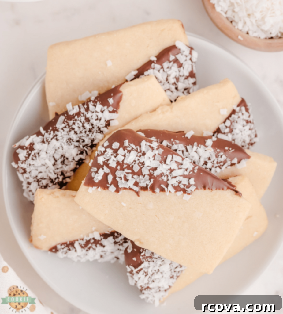Holiday Cookie Magic: Recipes for Festive Cheer 21 Coconut Shortbread Cookies dipped in chocolate
