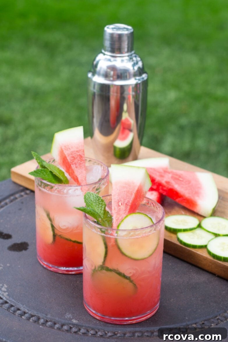 Refreshing Cucumber and Watermelon Mojitos 5 Watermelon & Cucumber Mojitos ready to be poured from a pitcher