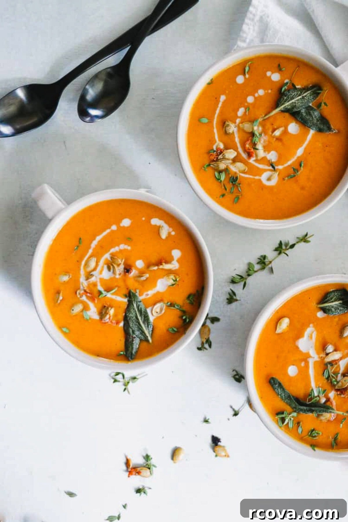 Velvety Dairy-Free Butternut Squash Soup with Carrots and Warming Spices 2 A beautifully garnished bowl of creamy roasted butternut squash and sage soup