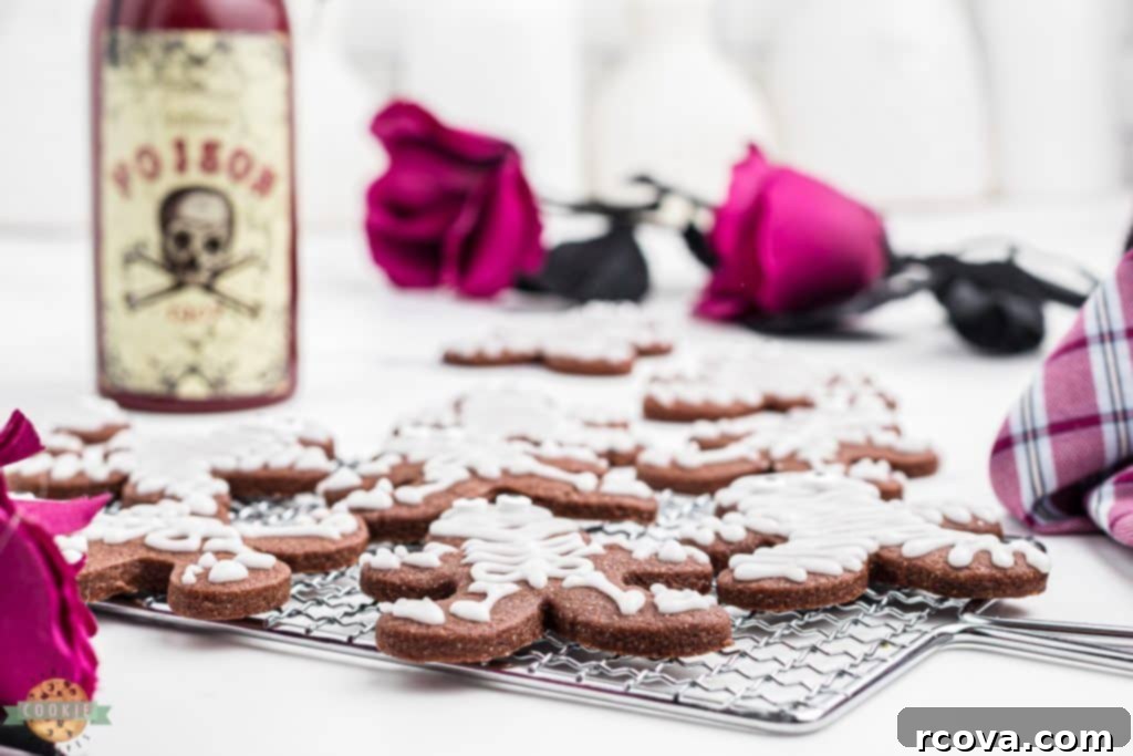 Sweetly Spooky Skeletons 4 halloween skeleton cookies on a cooling rack