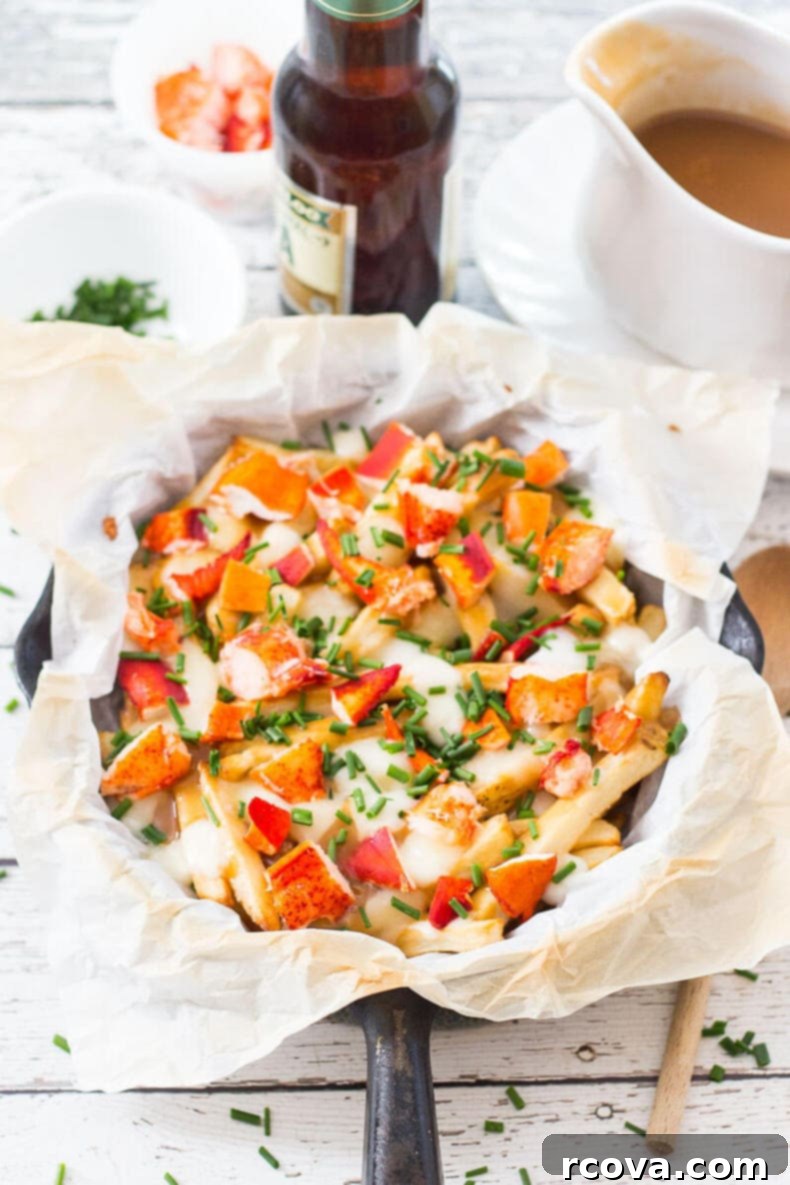 The Ultimate Canada Day Lobster Poutine 8 A bowl of Lobster Poutine with cutlery, ready to be eaten