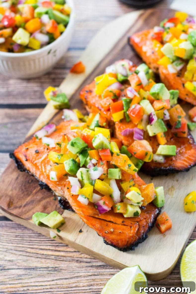 Effortless Grilled Salmon with Zesty Avocado Salsa 8 Cooked salmon fillet with avocado salsa, close-up