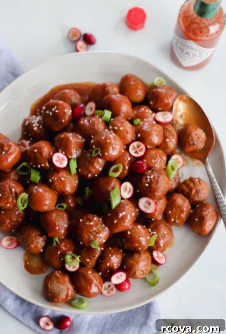 Slow Cooker Sweet and Spicy Cranberry Meatballs 2 Sweet and spicy cranberry meatballs in a slow cooker