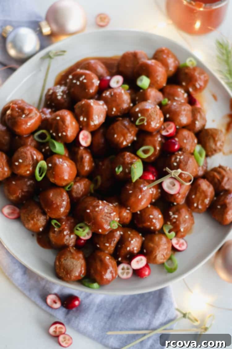 Slow Cooker Sweet and Spicy Cranberry Meatballs 4 Slow cooker filled with sweet and spicy cranberry meatballs, ready to serve
